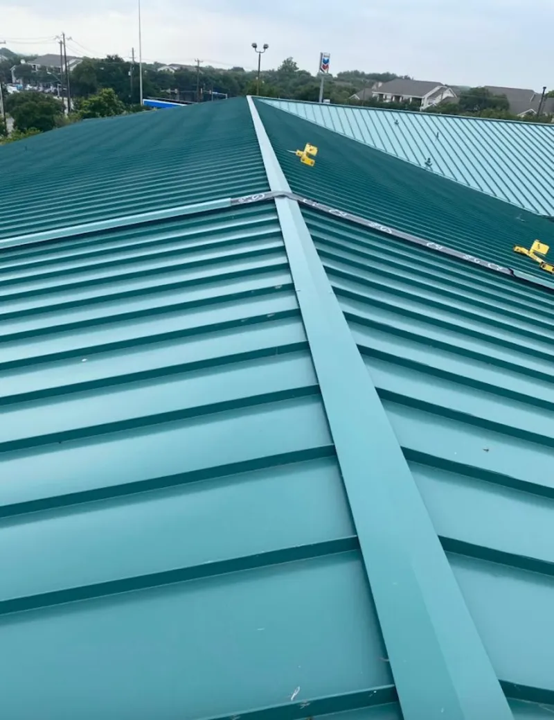Green commercial metal roof ridge and valley for Metal Roof Repair in Progreso